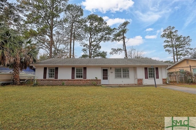 ranch-style house with a front lawn