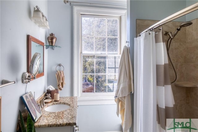 bathroom with vanity and curtained shower