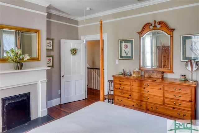 bedroom with dark hardwood / wood-style floors and ornamental molding