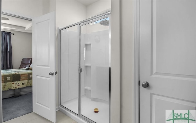 bathroom with tile patterned floors and an enclosed shower