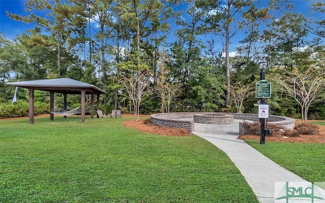 surrounding community with a gazebo and a lawn