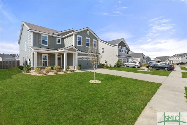 view of front of property featuring a garage and a front lawn