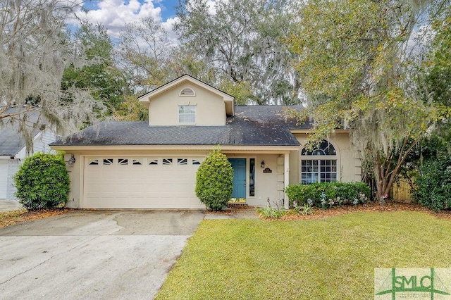 view of front of house featuring a garage and a front yard