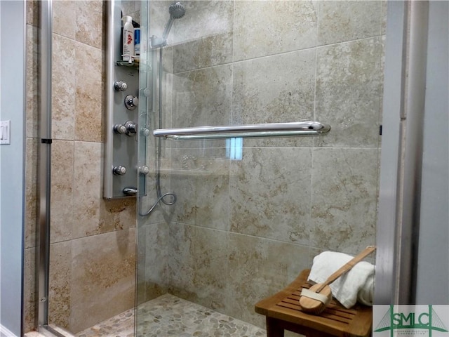 bathroom with a shower with shower door