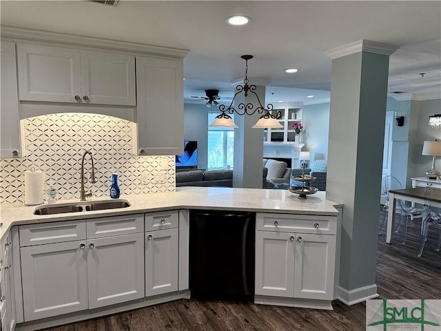 kitchen with sink, crown molding, dark wood-type flooring, dishwasher, and white cabinets