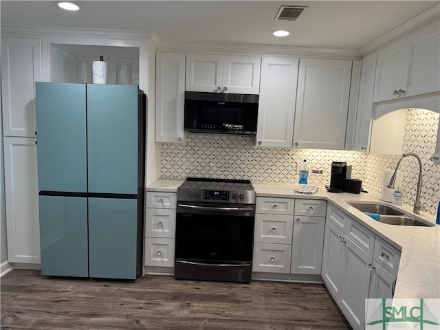 kitchen featuring dark hardwood / wood-style floors, refrigerator, white cabinetry, sink, and electric stove