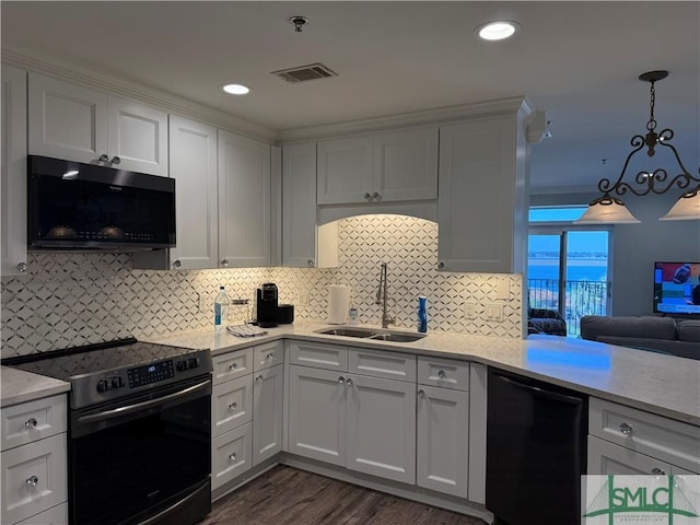 kitchen with decorative light fixtures, white cabinetry, dishwasher, sink, and electric stove