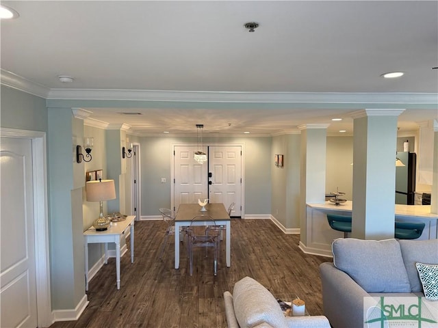 living room featuring dark wood-type flooring and crown molding