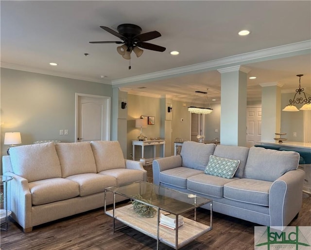 living room featuring ornamental molding, decorative columns, dark hardwood / wood-style floors, and ceiling fan