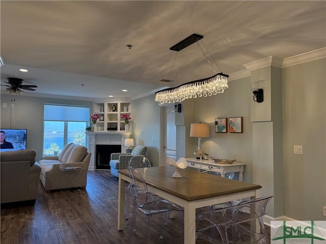 dining room with dark wood-type flooring, ceiling fan, and ornamental molding