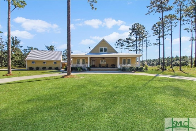 view of front facade featuring covered porch and a front lawn