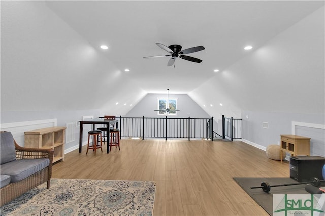 interior space with light hardwood / wood-style floors, vaulted ceiling, and ceiling fan