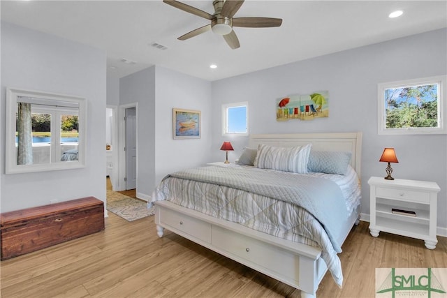 bedroom featuring ceiling fan and light hardwood / wood-style flooring