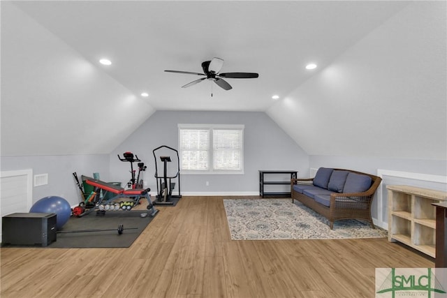 workout area featuring hardwood / wood-style floors, ceiling fan, and lofted ceiling