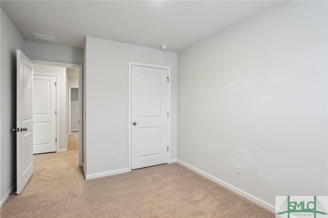 435 Salvia Rd, Bloomingdale, GA 31302 - unfurnished bedroom featuring baseboards and light carpet