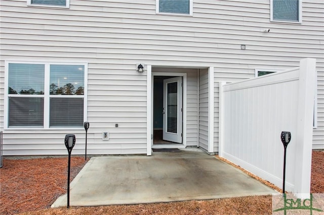 entrance to property featuring a patio