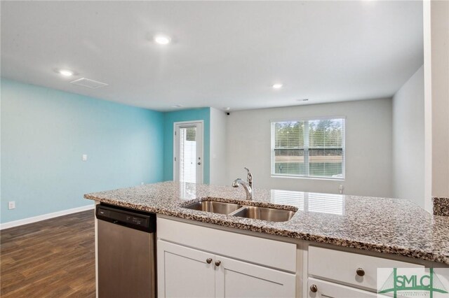 kitchen with light stone counters, stainless steel dishwasher, dark hardwood / wood-style floors, white cabinets, and sink