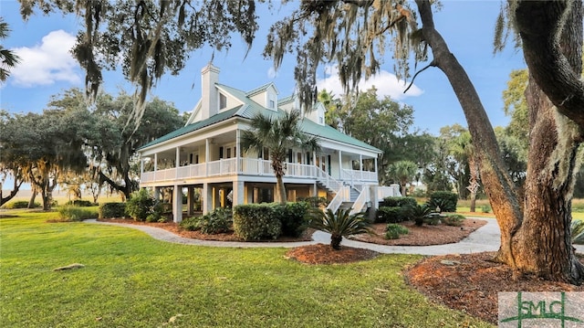 exterior space with a porch and a lawn