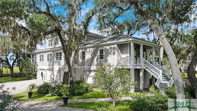 view of front of home featuring covered porch and a garage