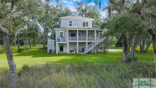 back of property featuring a lawn