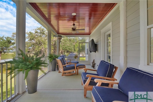 exterior space with ceiling fan and wood ceiling