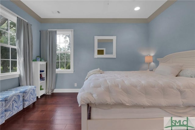 bedroom with dark hardwood / wood-style flooring