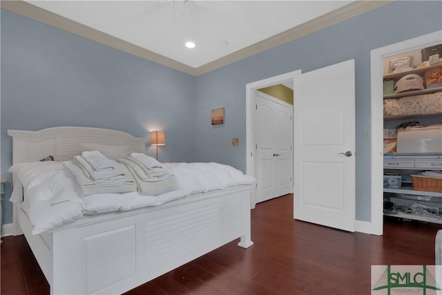 bedroom featuring dark hardwood / wood-style floors and ornamental molding