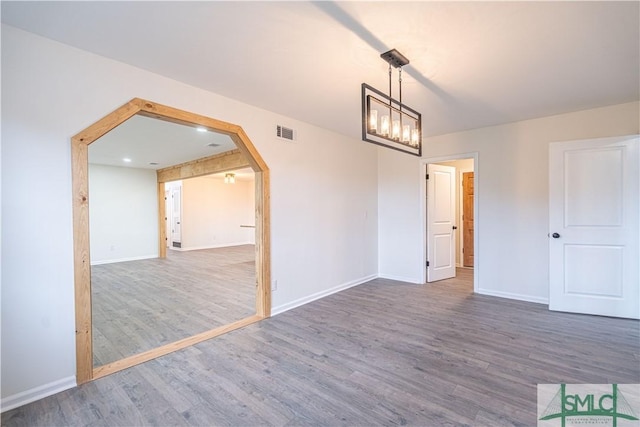 unfurnished room featuring dark hardwood / wood-style flooring