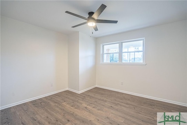 empty room featuring ceiling fan and hardwood / wood-style floors