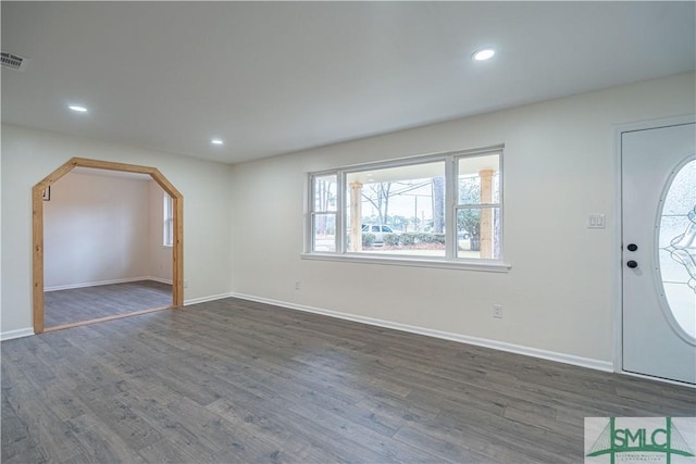 entrance foyer with dark hardwood / wood-style floors