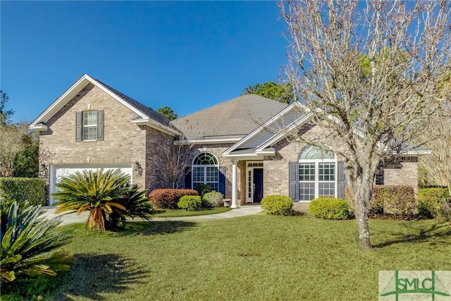 front of property featuring a front lawn and a garage