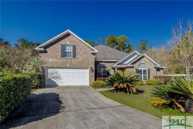 front of property with a front lawn and a garage