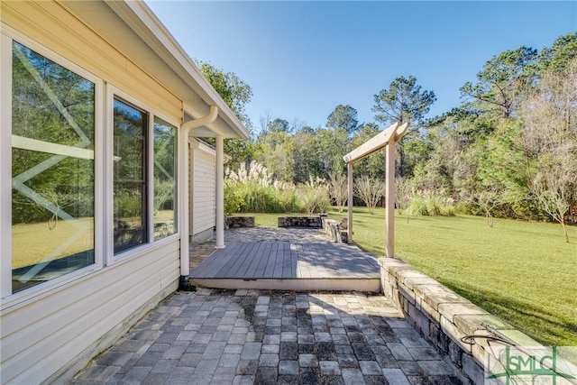 deck featuring a yard and a patio area