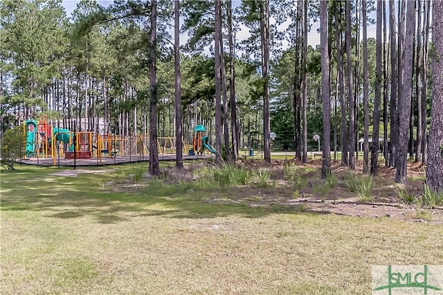 view of playground with a lawn