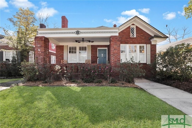 view of front of home featuring a porch and a front yard