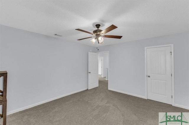 unfurnished bedroom featuring ceiling fan and carpet flooring