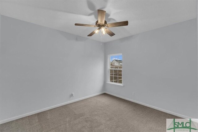 empty room with carpet flooring and ceiling fan