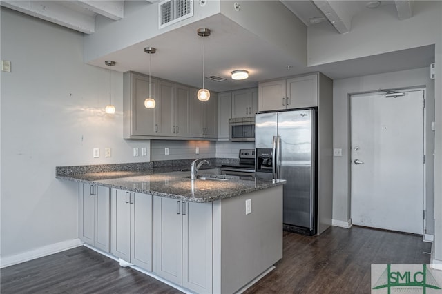 kitchen with kitchen peninsula, decorative light fixtures, stainless steel appliances, gray cabinetry, and sink