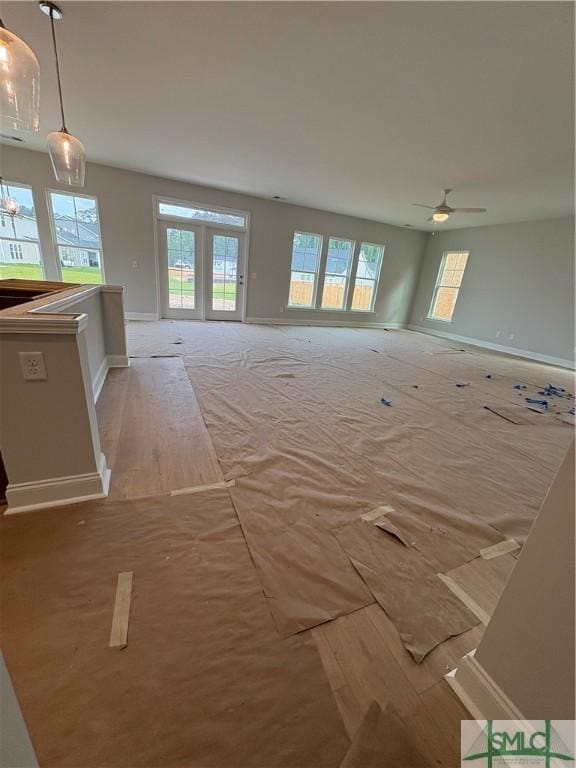 541 Sessile Oak Dr, Savannah, GA 31419 - unfurnished living room featuring healthy amount of natural light, baseboards, and a ceiling fan