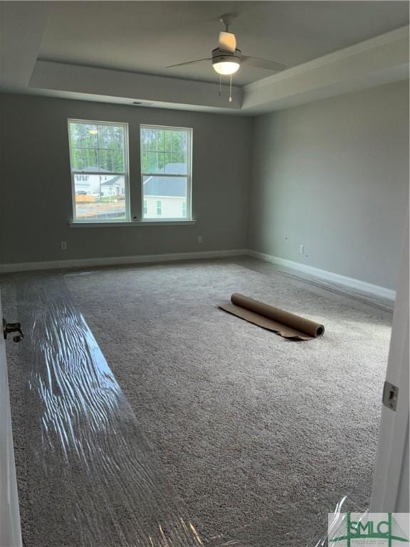 541 Sessile Oak Dr, Savannah, GA 31419 - carpeted empty room with a raised ceiling, ceiling fan, and baseboards