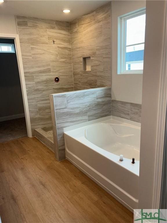 541 Sessile Oak Dr, Savannah, GA 31419 - bathroom featuring a bath, wood finished floors, and a walk in shower
