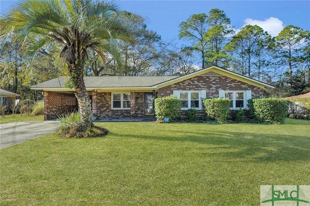 ranch-style house with a front yard and a carport