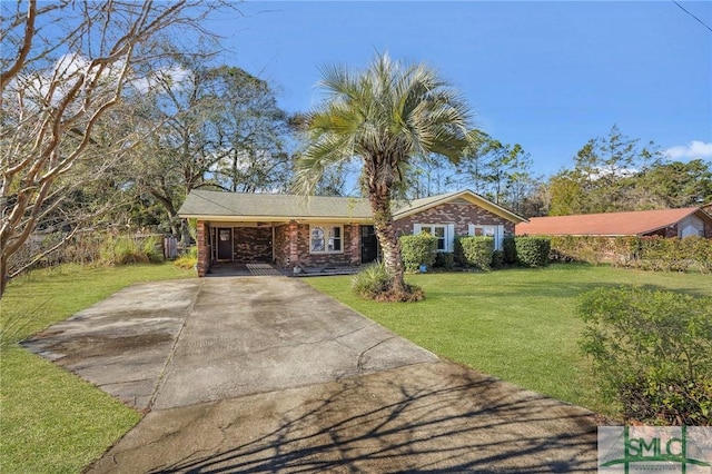 ranch-style home featuring a carport and a front yard