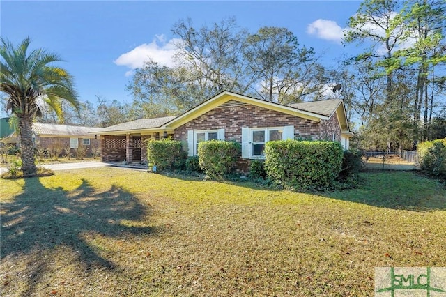 ranch-style home with a front yard