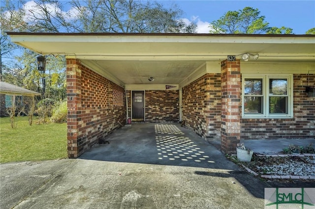 property entrance with a carport