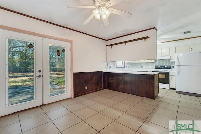 kitchen featuring kitchen peninsula, electric stove, white fridge, white cabinets, and dark brown cabinets