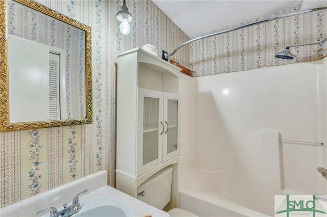 full bathroom featuring bathing tub / shower combination, vanity, and toilet