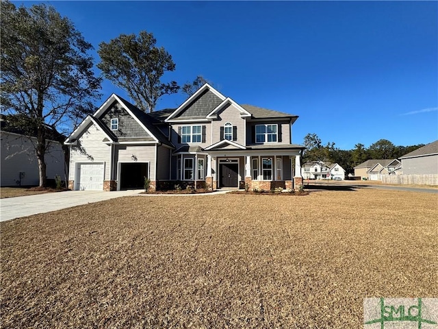 craftsman inspired home featuring a porch and a garage