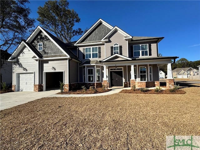 craftsman house featuring a porch and a garage