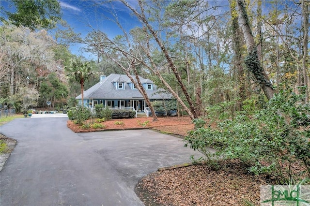 cape cod home with covered porch